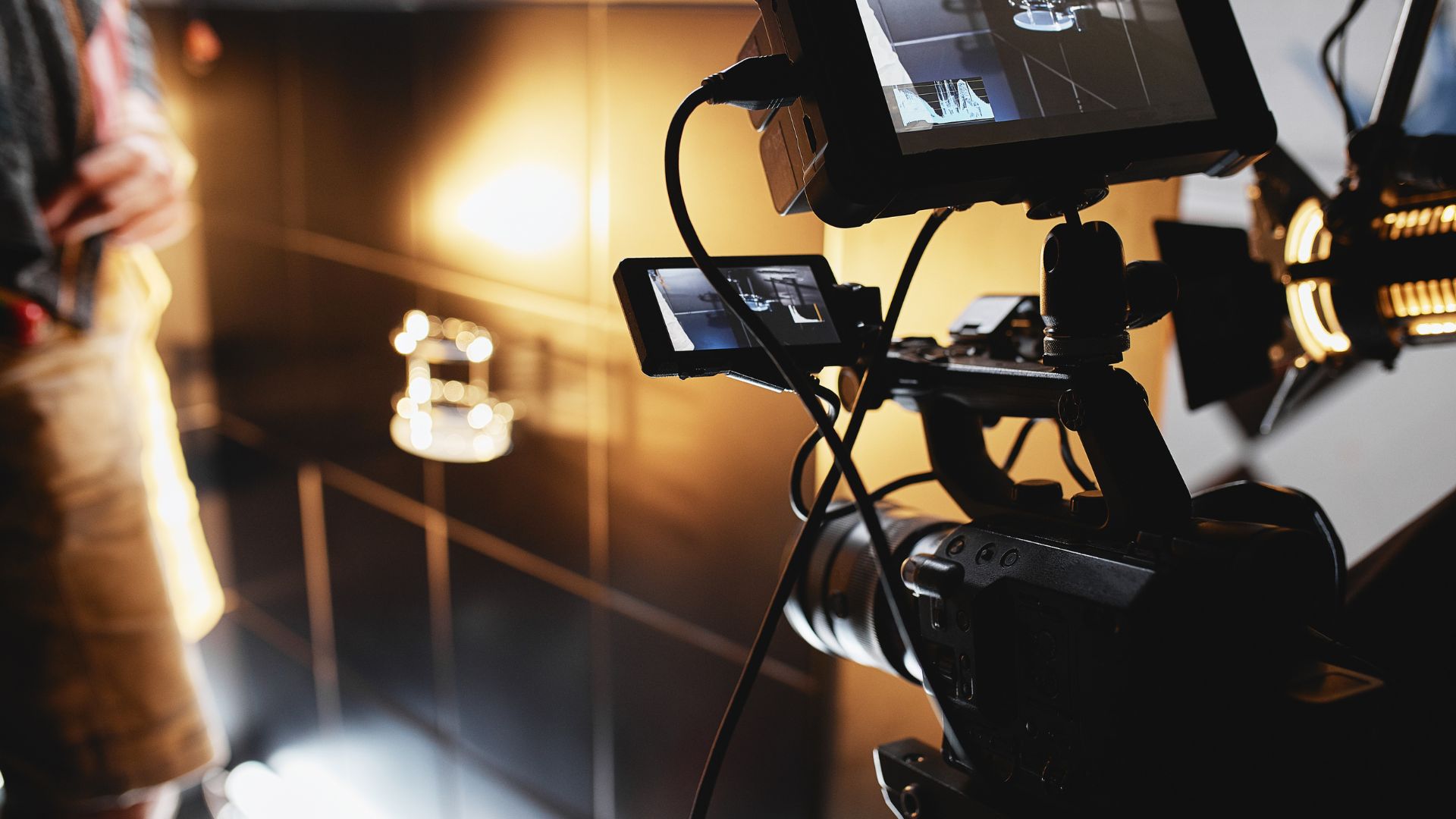 Professional video camera with monitors on set during film production